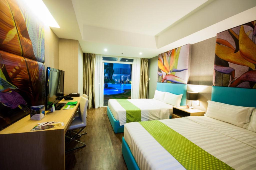 Postel nebo postele na pokoji v ubytování Aziza Paradise Hotel