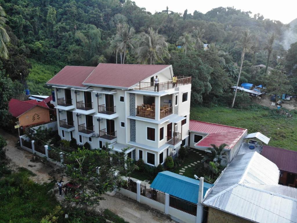 an aerial view of a house with a roof at Layang Layang Home in El Nido