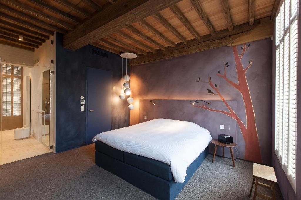 Postel nebo postele na pokoji v ubytování B&B La Suite