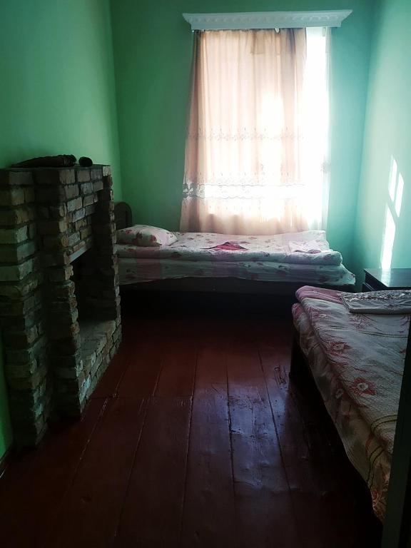 Postel nebo postele na pokoji v ubytování Raul Lushnu Darbaz