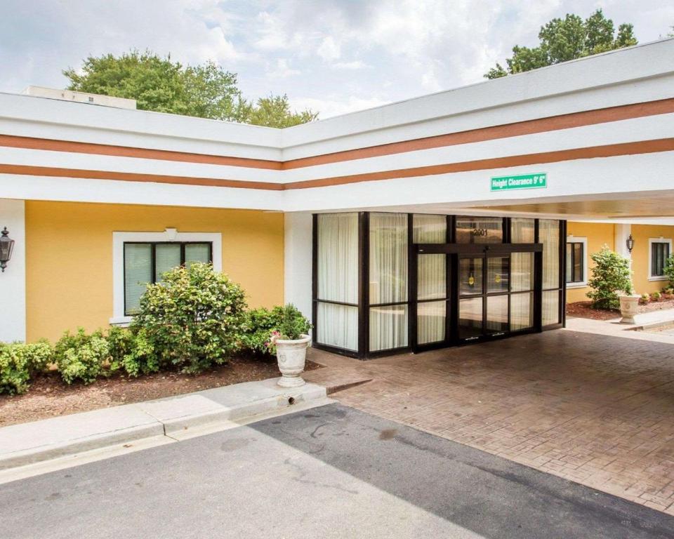 a building with the entrance to a building at Budgetel Inn & Suites Atlanta in Atlanta