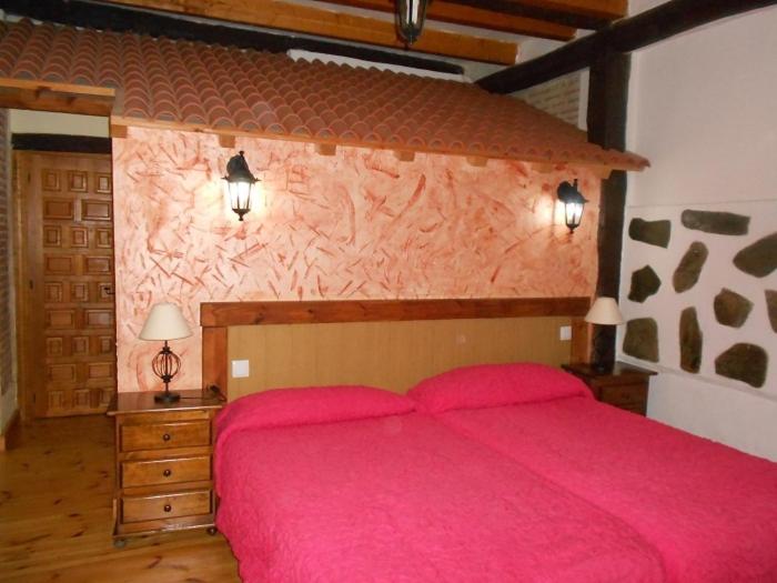 Postel nebo postele na pokoji v ubytování La Mesnadita