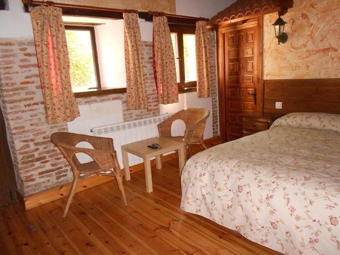 Postel nebo postele na pokoji v ubytování La Mesnadita