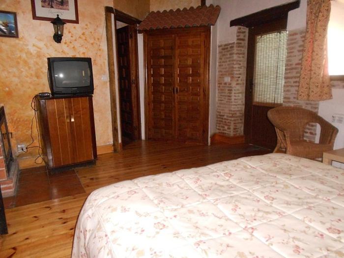 Postel nebo postele na pokoji v ubytování La Mesnadita