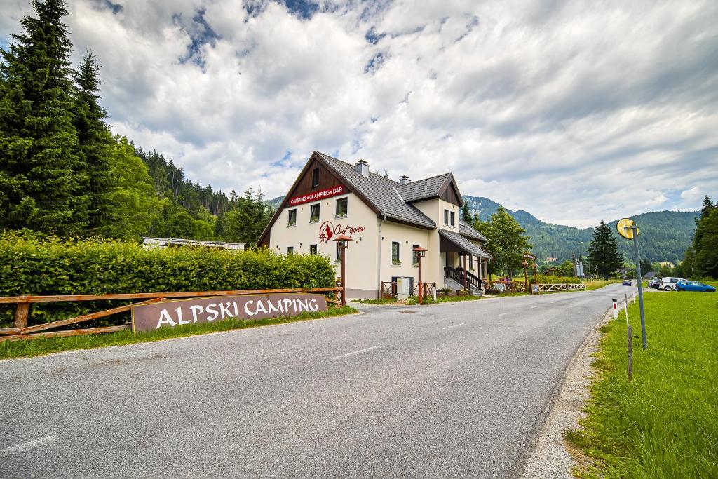 a building on the side of a road at Cvet gora - Camping, Glamping and Accomodations in Zgornje Jezersko