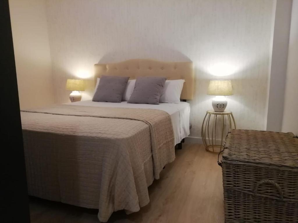 Posteľ alebo postele v izbe v ubytovaní Apartamentos Los Lobos