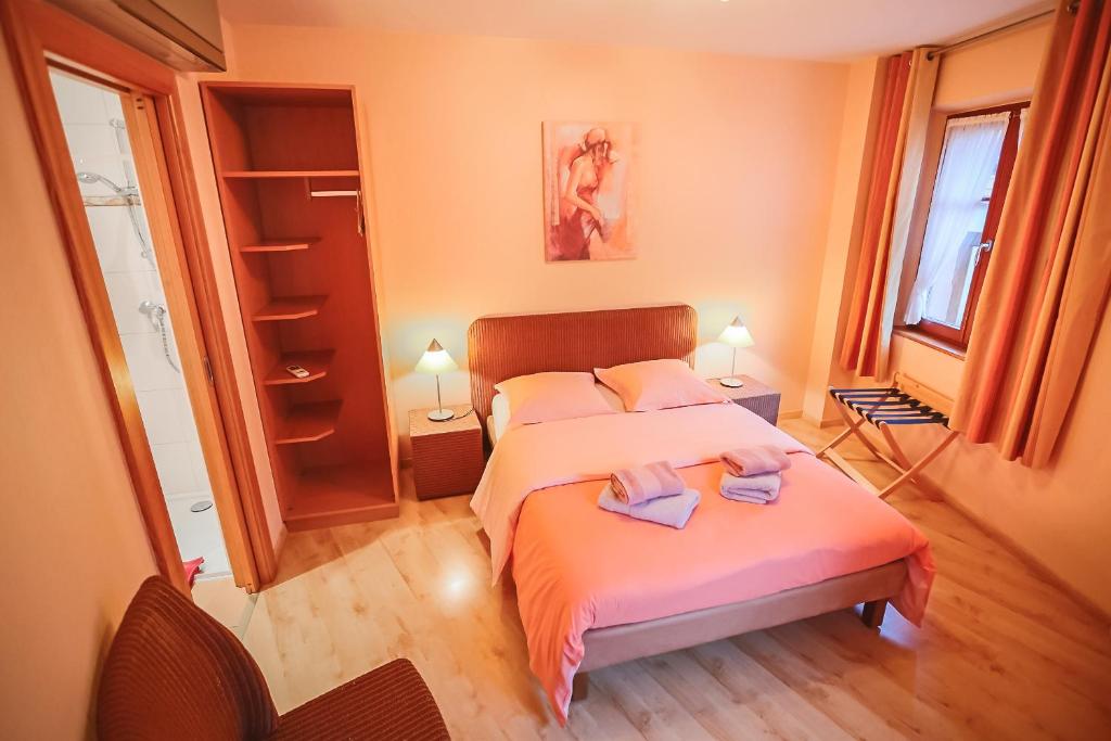Postel nebo postele na pokoji v ubytování B&B Relais du Vigneron - Jean-Luc et Bruno Meyer