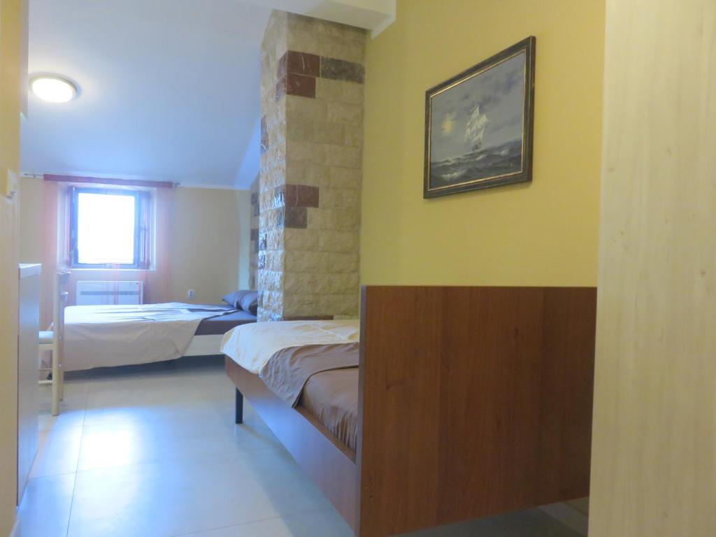 Łóżko lub łóżka w pokoju w obiekcie Villa Adriatic