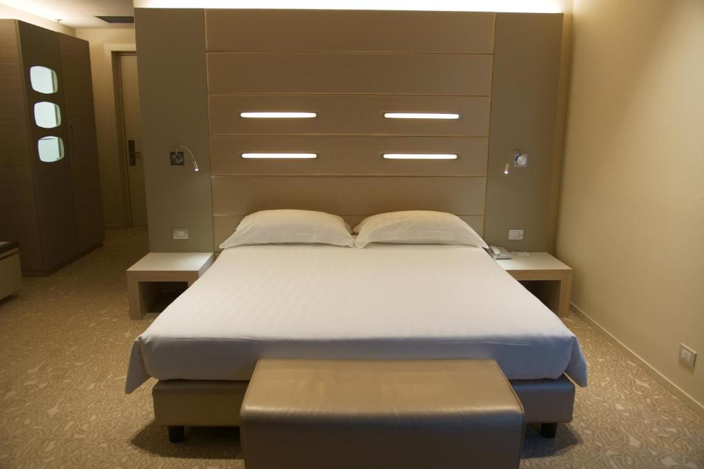 Krevet ili kreveti u jedinici u okviru objekta Best Western Plus Net Tower Hotel Padova