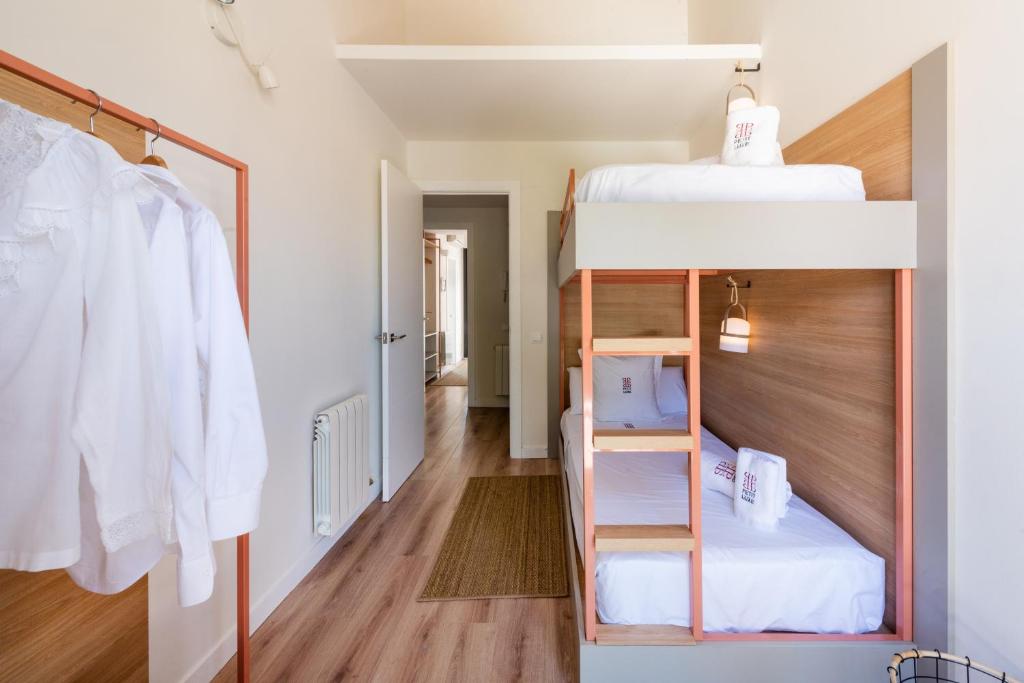 Posteľ alebo postele v izbe v ubytovaní Petit Luxe Tobella Dreta