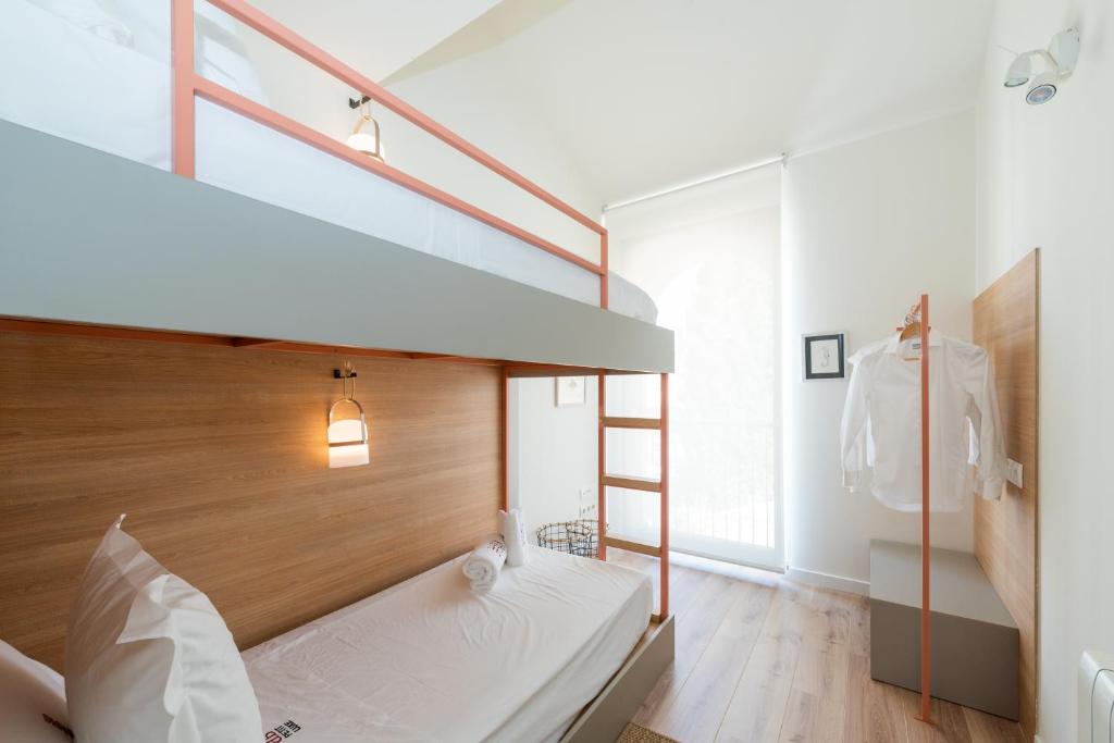 Posteľ alebo postele v izbe v ubytovaní Petit Luxe Tobella Dreta