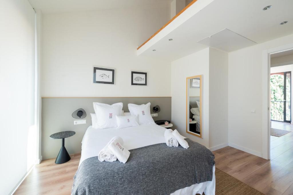 Posteľ alebo postele v izbe v ubytovaní Petit Luxe Tobella Dreta