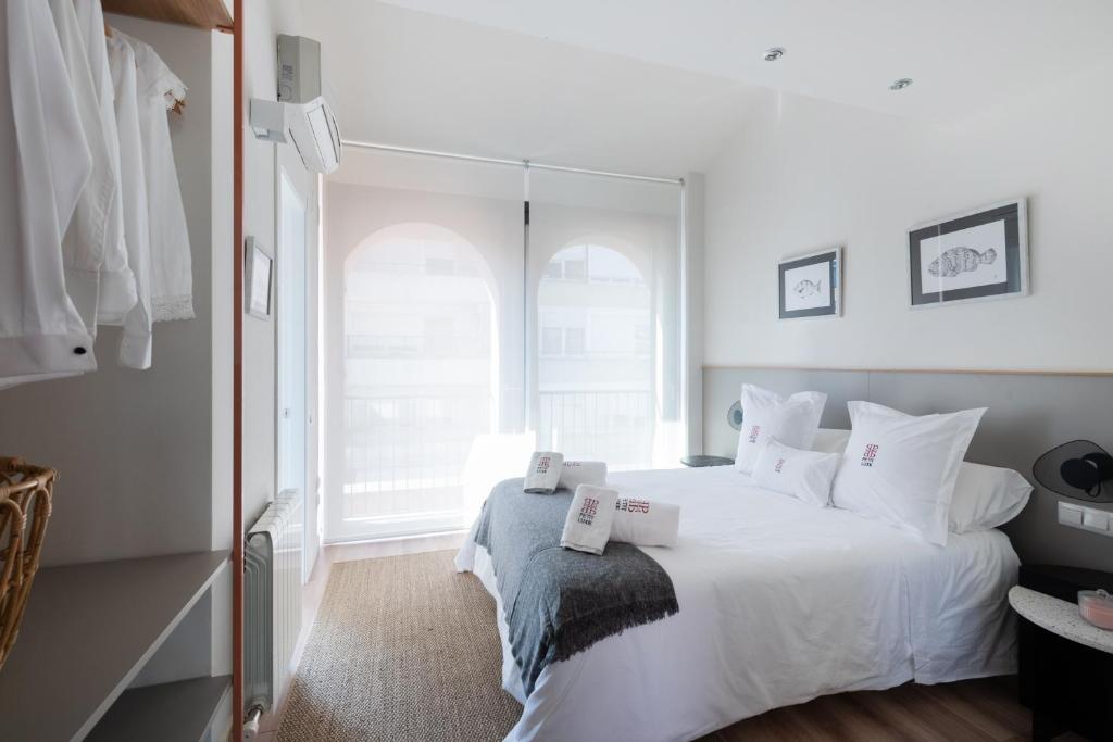 Posteľ alebo postele v izbe v ubytovaní Petit Luxe Tobella Dreta