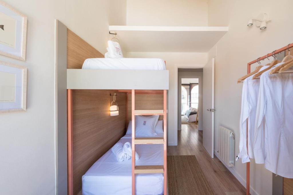 Posteľ alebo postele v izbe v ubytovaní Petit Luxe Tobella Dreta