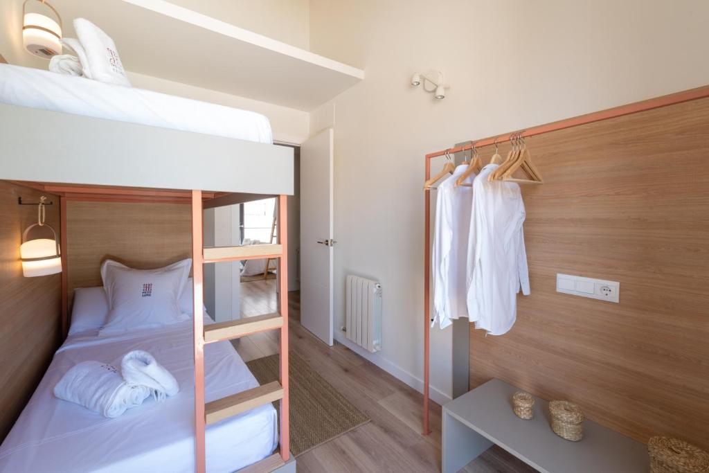 Posteľ alebo postele v izbe v ubytovaní Petit Luxe Tobella Dreta