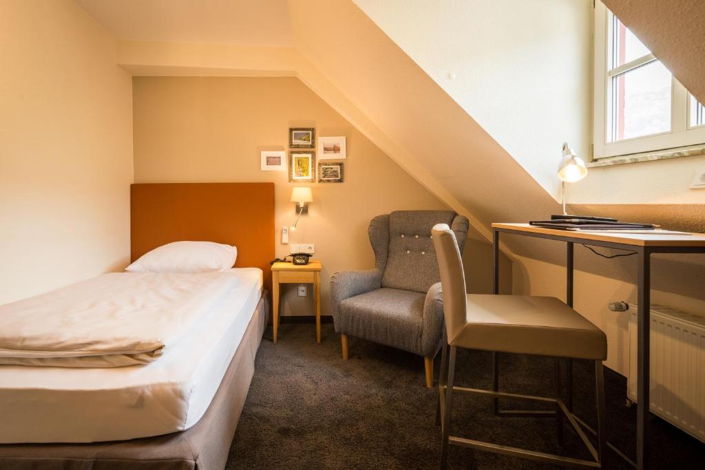 Ein Bett oder Betten in einem Zimmer der Unterkunft Hotel Deutschherrenhof