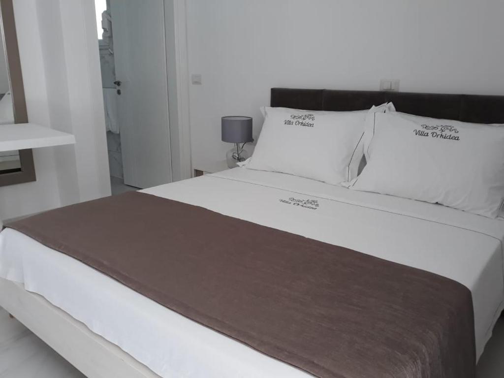Letto o letti in una camera di Villa Orkidea