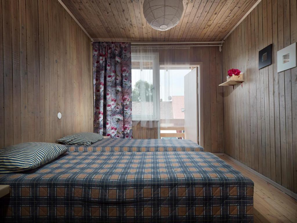 Postel nebo postele na pokoji v ubytování Zunda