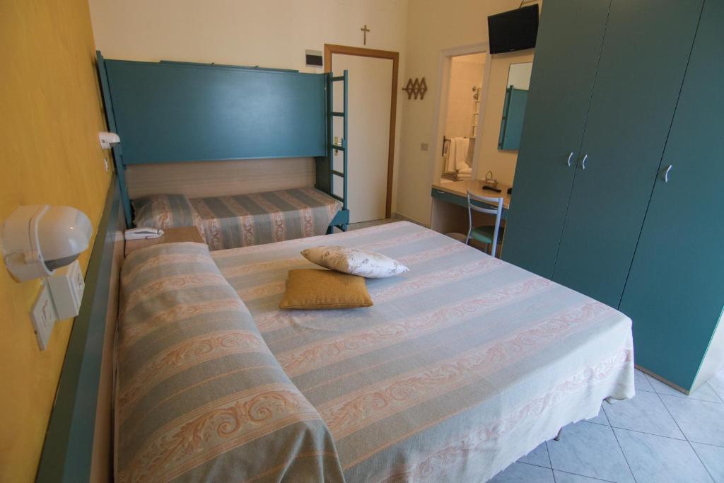 Postel nebo postele na pokoji v ubytování Hotel Solidea