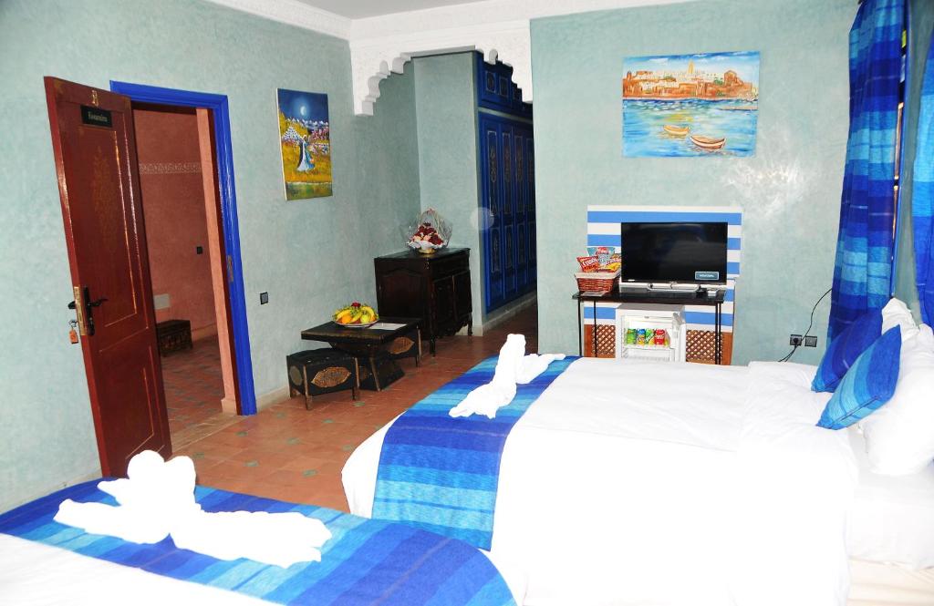 Postel nebo postele na pokoji v ubytování Riad Mhidou
