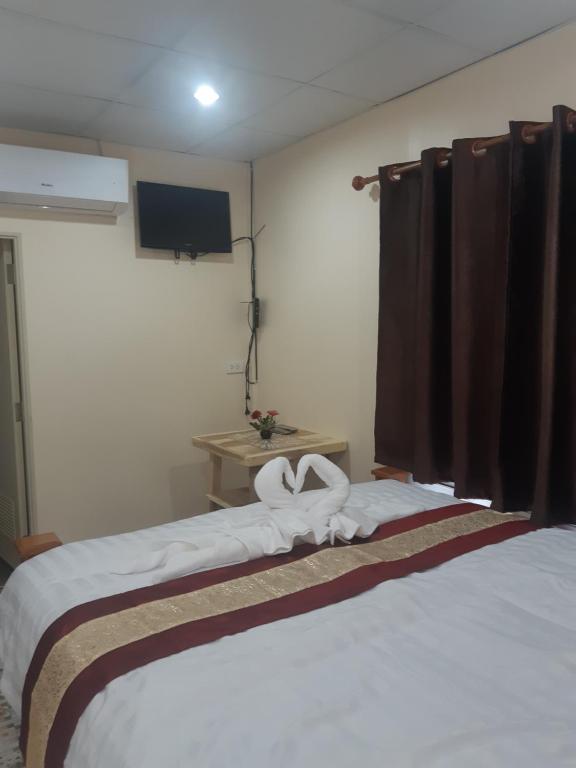 Ένα ή περισσότερα κρεβάτια σε δωμάτιο στο Mae kuawn Resort