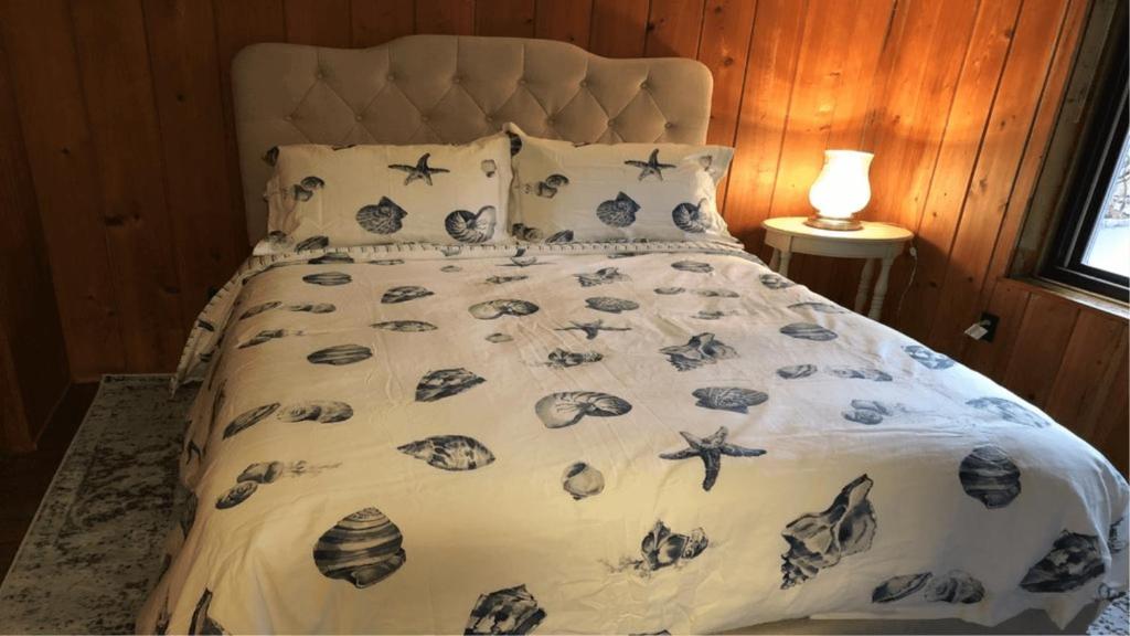 Postel nebo postele na pokoji v ubytování Villa Perlman