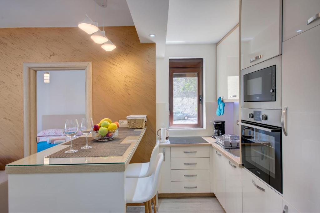 Kuchyň nebo kuchyňský kout v ubytování Apartment Medusa