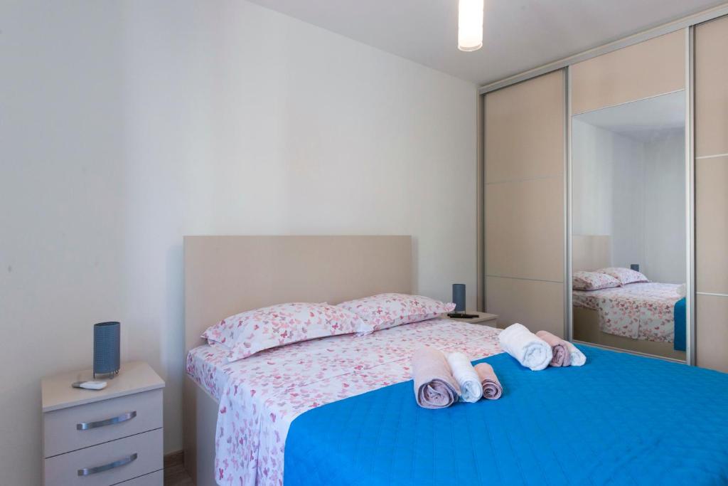 Postel nebo postele na pokoji v ubytování Apartment Medusa