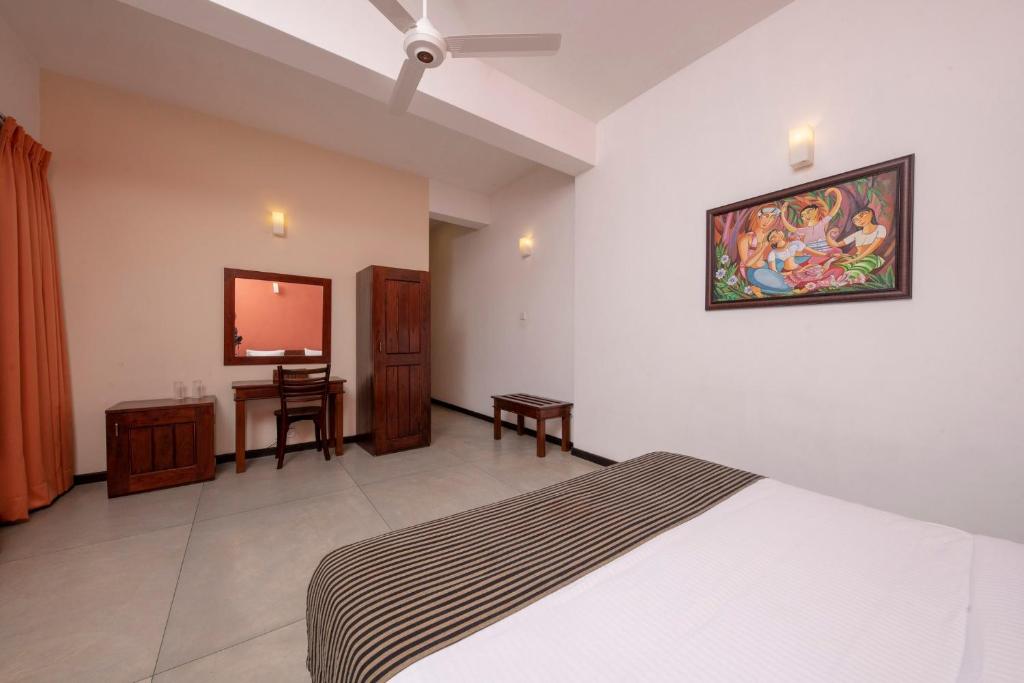 Postel nebo postele na pokoji v ubytování Melheim Kandy Villas