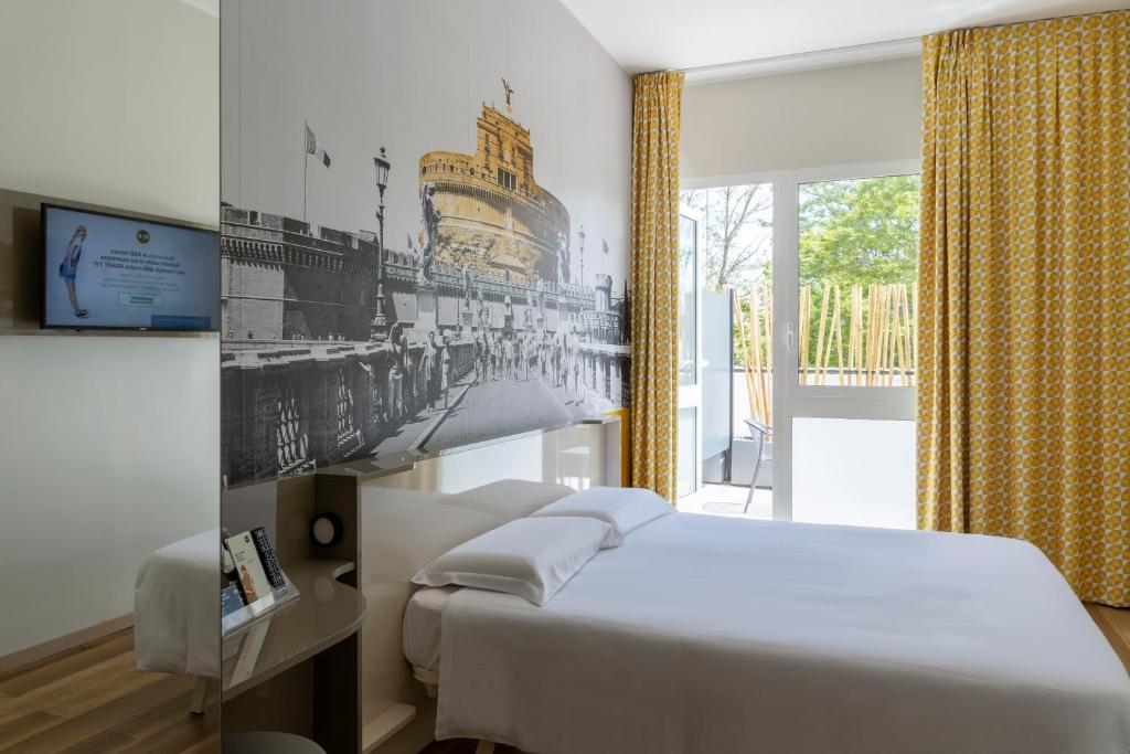 מיטה או מיטות בחדר ב-B&B Hotel Roma Pietralata Tiburtina