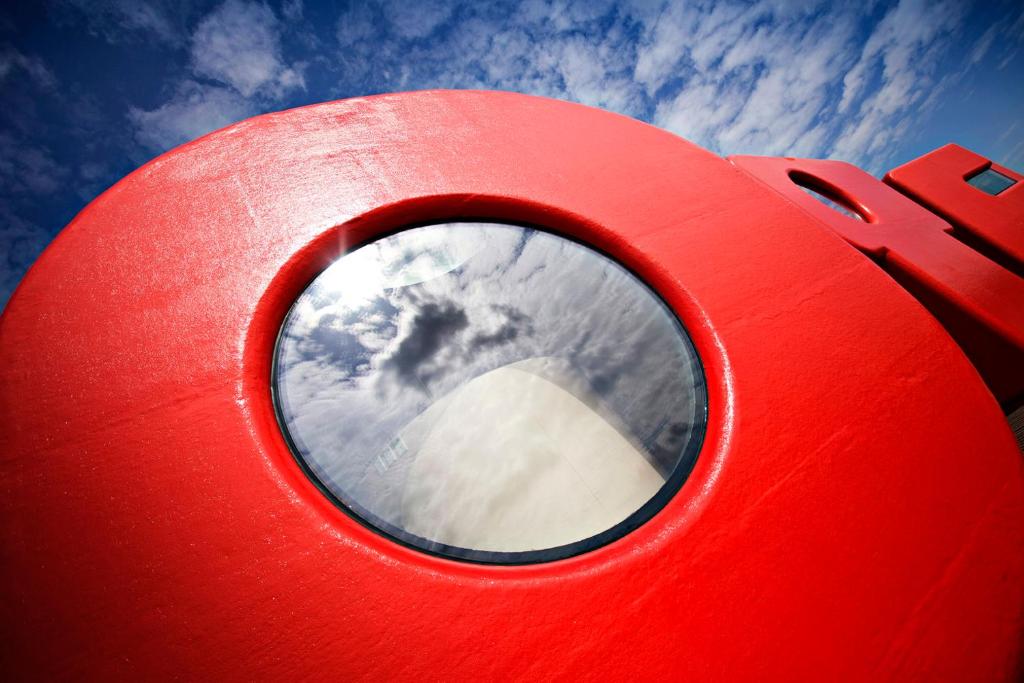 a red object with the sky in the background at Botel in Amsterdam