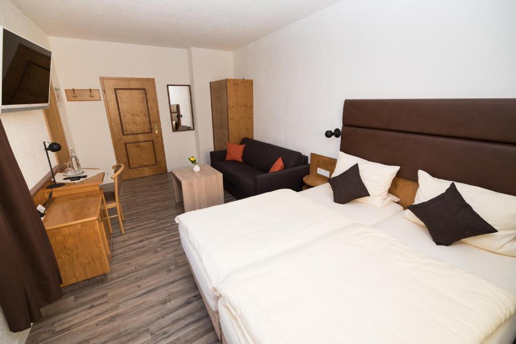 Postel nebo postele na pokoji v ubytování Hotel PIAZZA