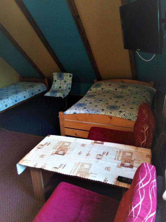 Postel nebo postele na pokoji v ubytování Pod Kasztanem