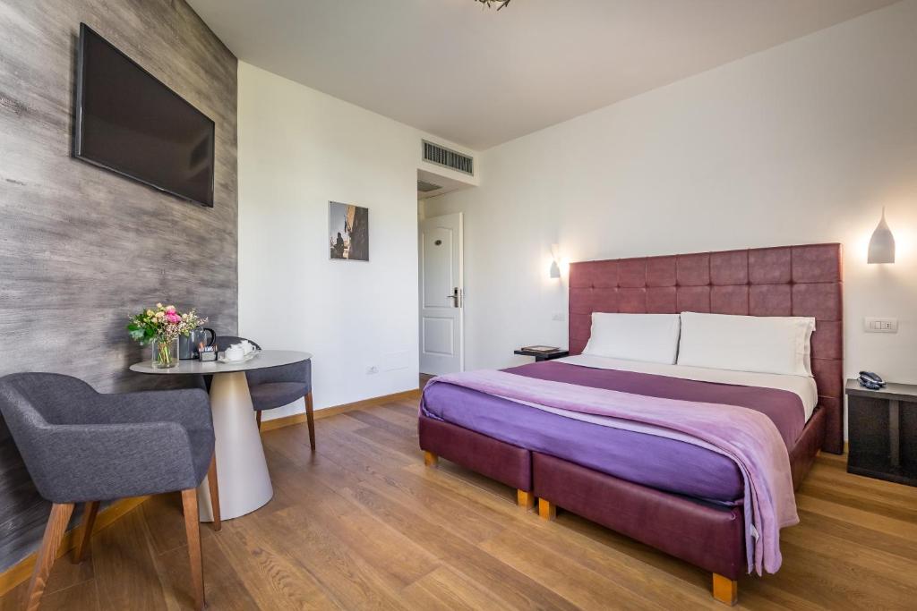 Postel nebo postele na pokoji v ubytování Hotel La Scaletta al Ponte Vecchio
