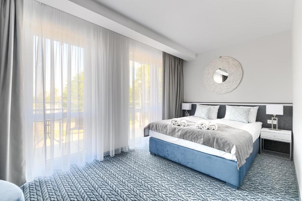 Postel nebo postele na pokoji v ubytování Szymański Holiday Rooms