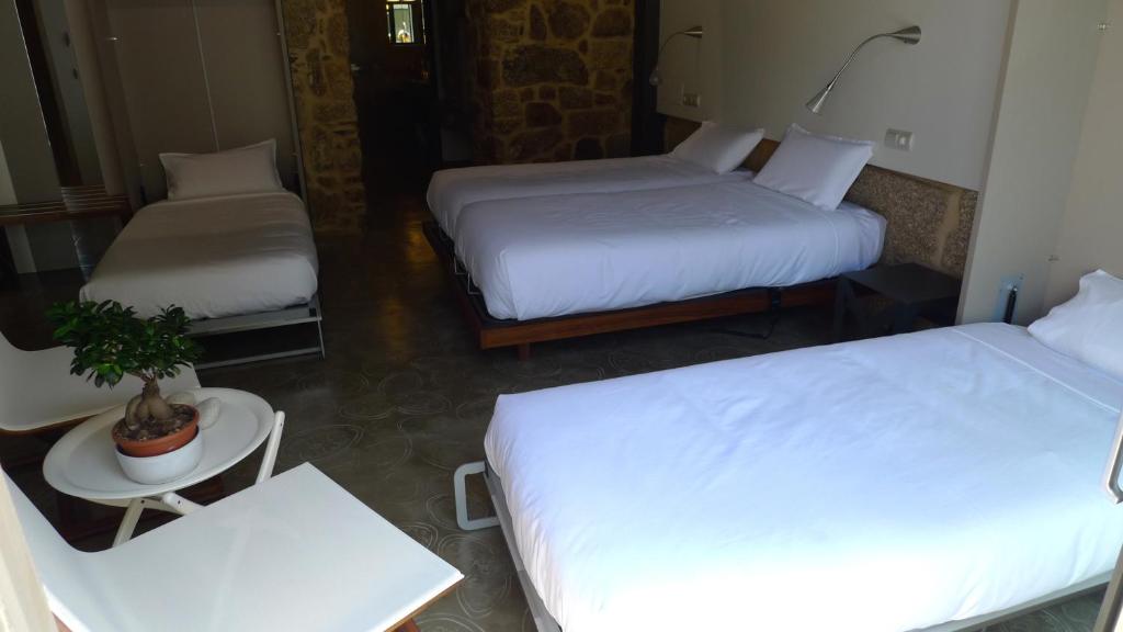 Posteľ alebo postele v izbe v ubytovaní Blanco Apartamentos Turísticos