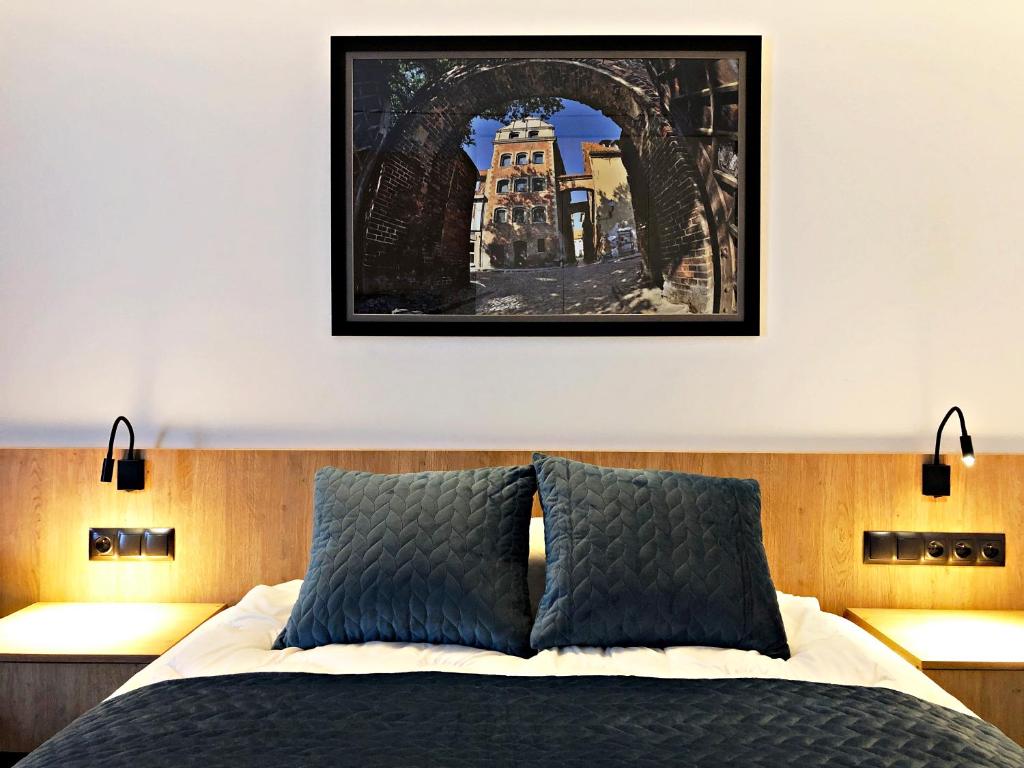 Posteľ alebo postele v izbe v ubytovaní Apartamenty 242