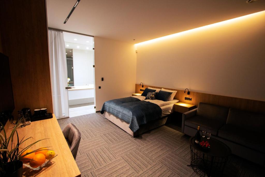 Posteľ alebo postele v izbe v ubytovaní Apartamenty 242