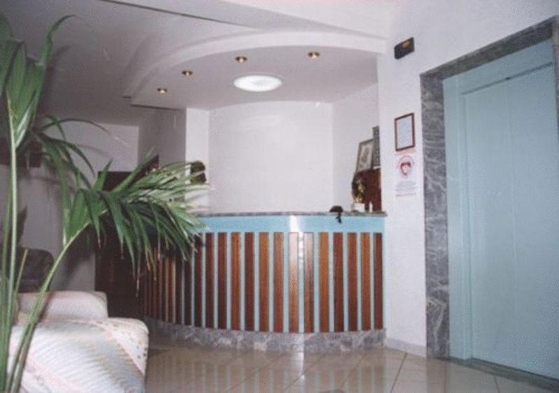 a living room with a room with a partition and a room at Hotel Royal in Coccorino