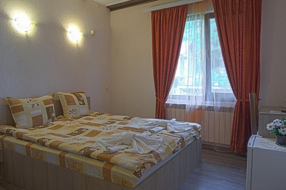 Postel nebo postele na pokoji v ubytování СТАР МЕРАК