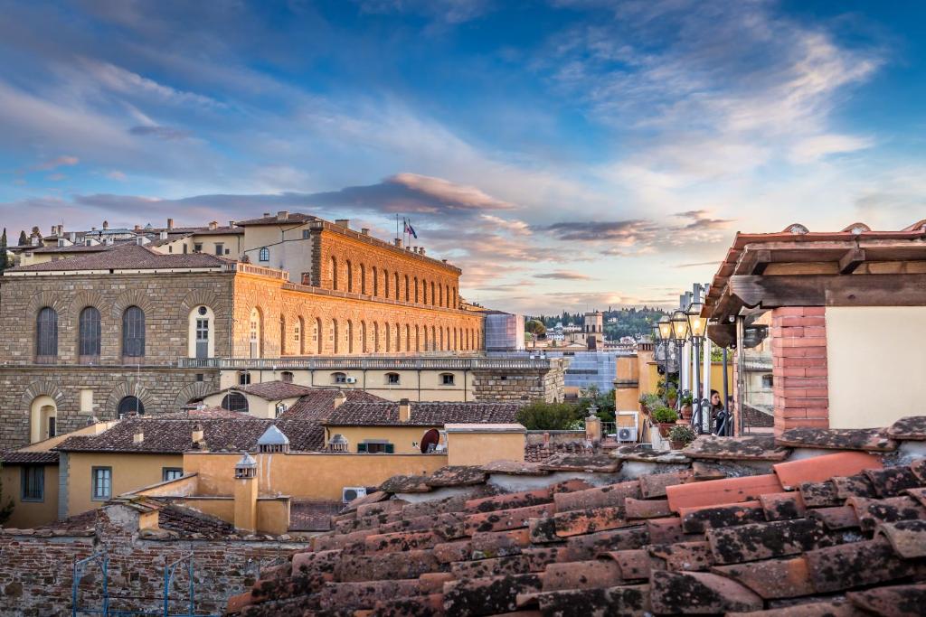 a view of the city from the roofs of buildings at Hotel La Scaletta al Ponte Vecchio in Florence