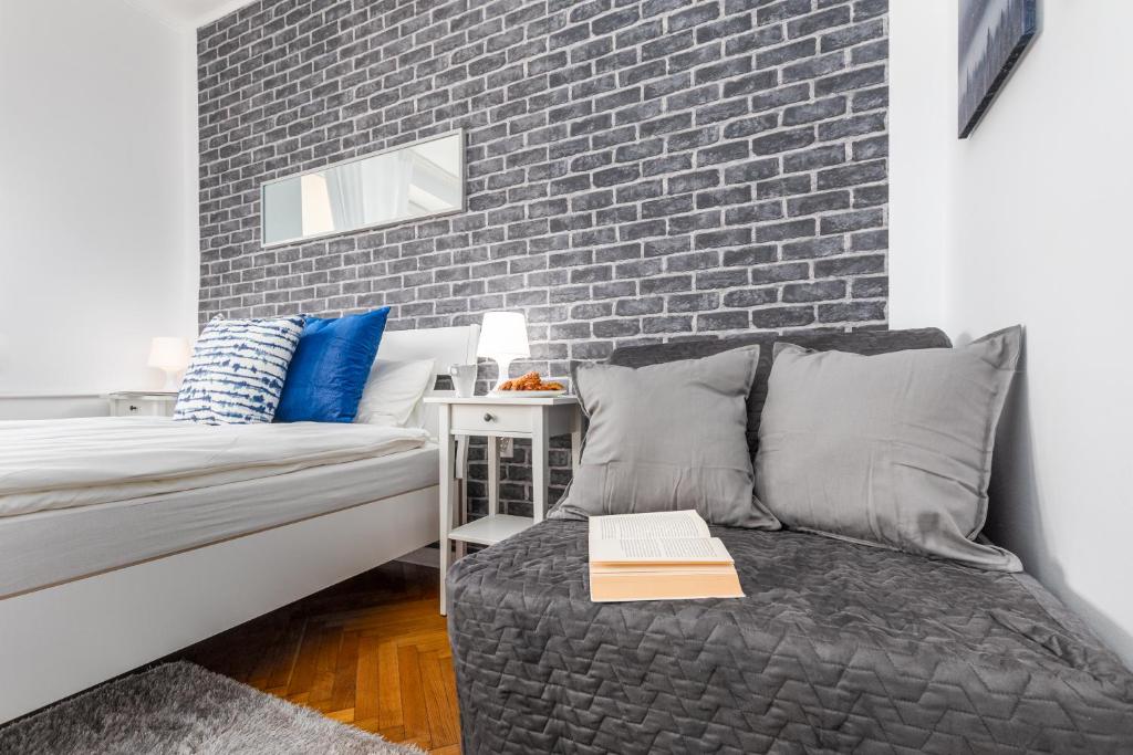 Posteľ alebo postele v izbe v ubytovaní Apartments Madelaine Warsaw by Noclegi Renters
