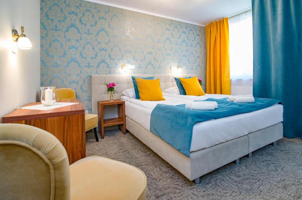Postel nebo postele na pokoji v ubytování Pod Wzgórzem Bed & Breakfast