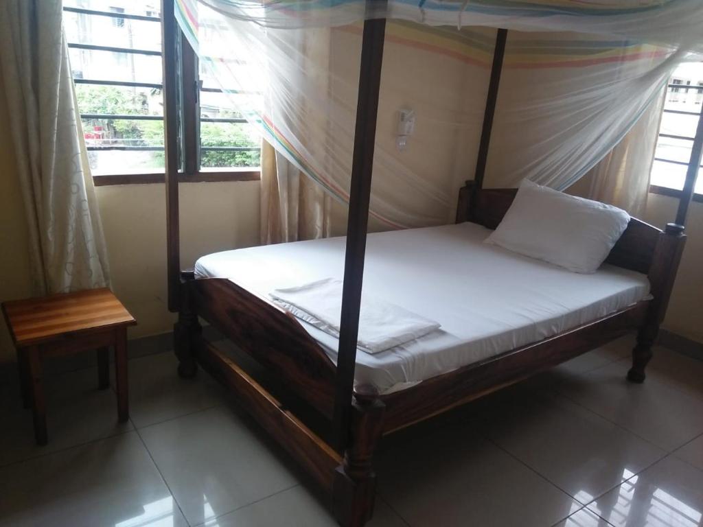Postel nebo postele na pokoji v ubytování Cingaki Hotel