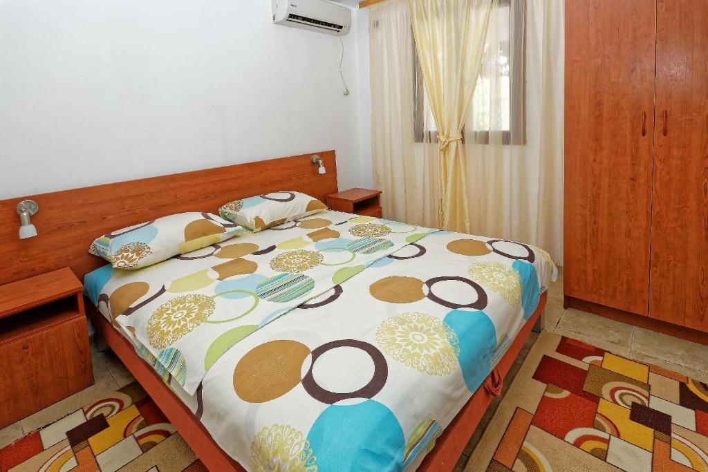 Postel nebo postele na pokoji v ubytování Apartments Ajla