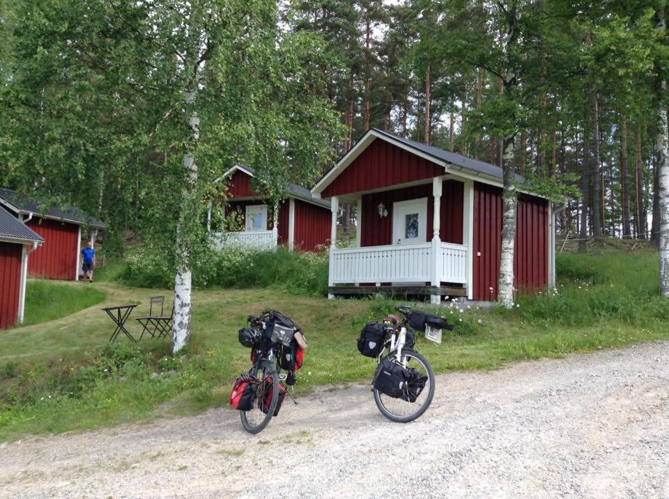 two bikes are parked in front of a cabin at Grindhammaren B&B in Ramsberg