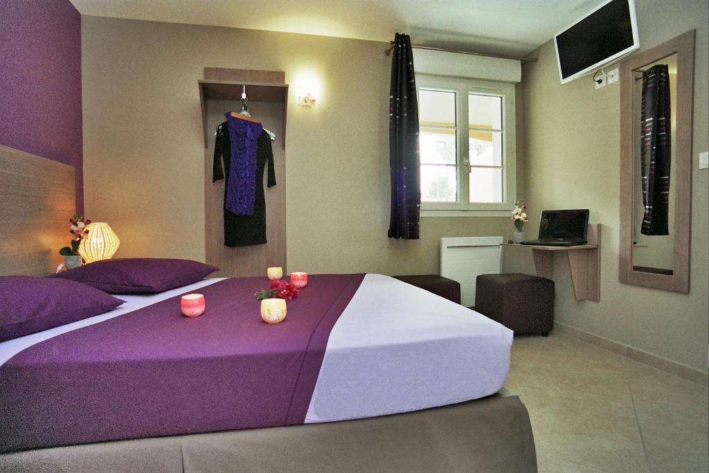 Postel nebo postele na pokoji v ubytování Hôtel l'Anvia