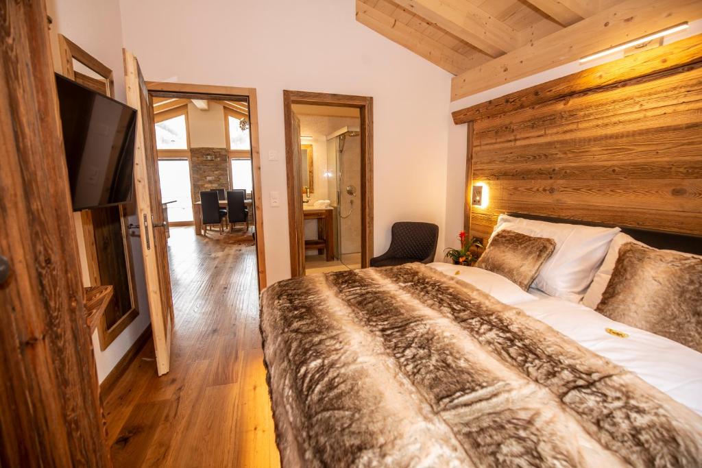 Postel nebo postele na pokoji v ubytování Palace Luxury Wellness Apartment and Boutique Hotel Ski-in-out