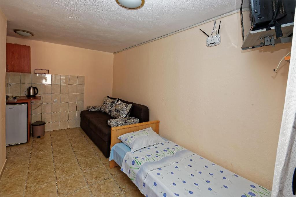 Kuchyň nebo kuchyňský kout v ubytování Apartments Ajla