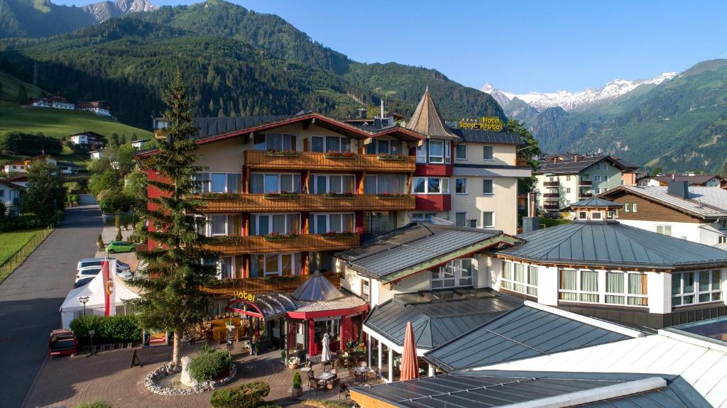 an aerial view of a hotel with mountains in the background at Vötter's Hotel in Kaprun